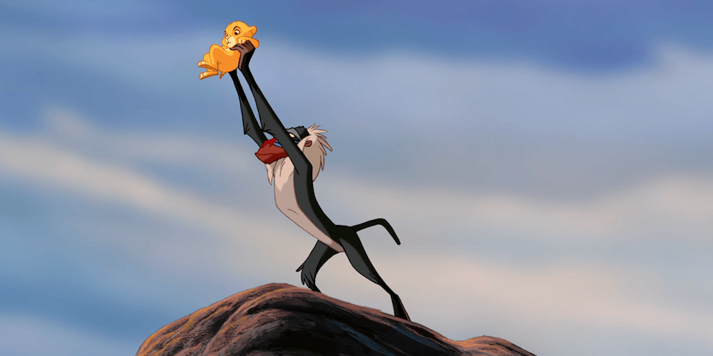 Rafiki holds newborn Simba up to the Animal Kingdom